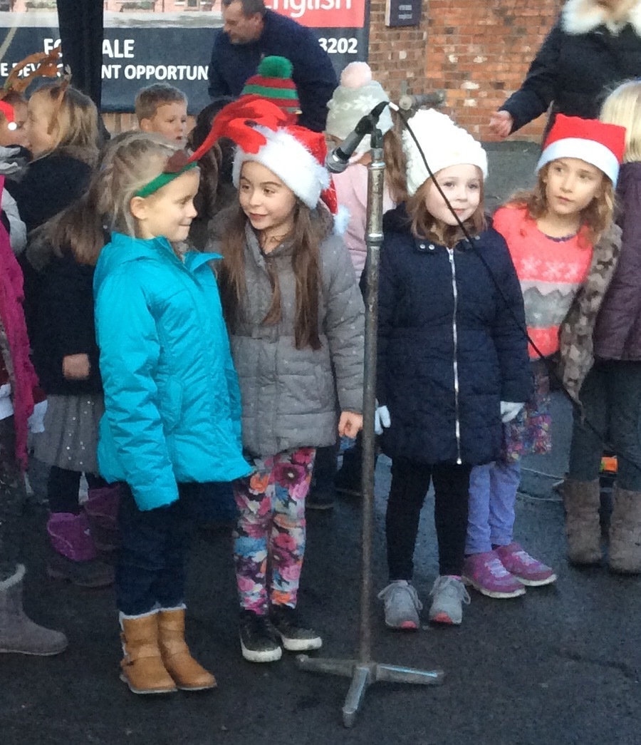 Singing in the village square at Christmas